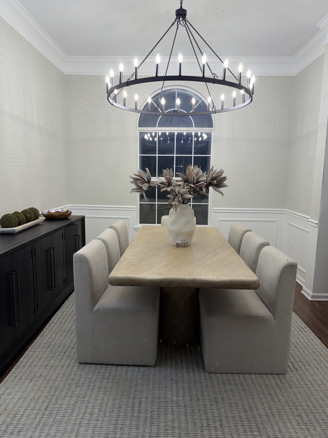 Dining room with upholstered seating and statement chandelier
