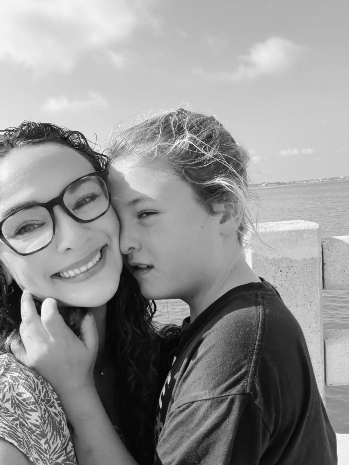 Lauren and her son Jasper sharing a moment together by the water