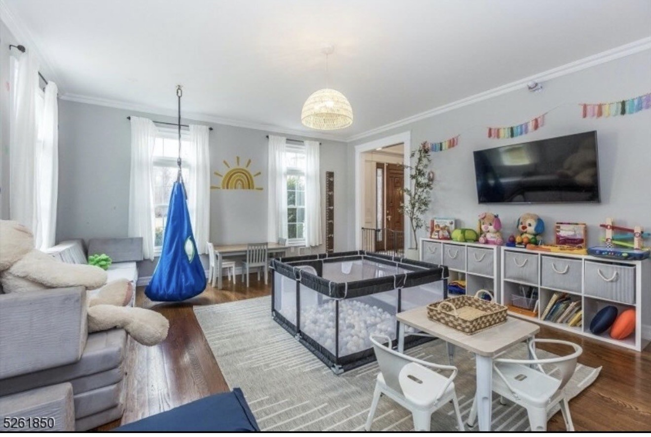 Family play space with sensory swing and organized toy storage